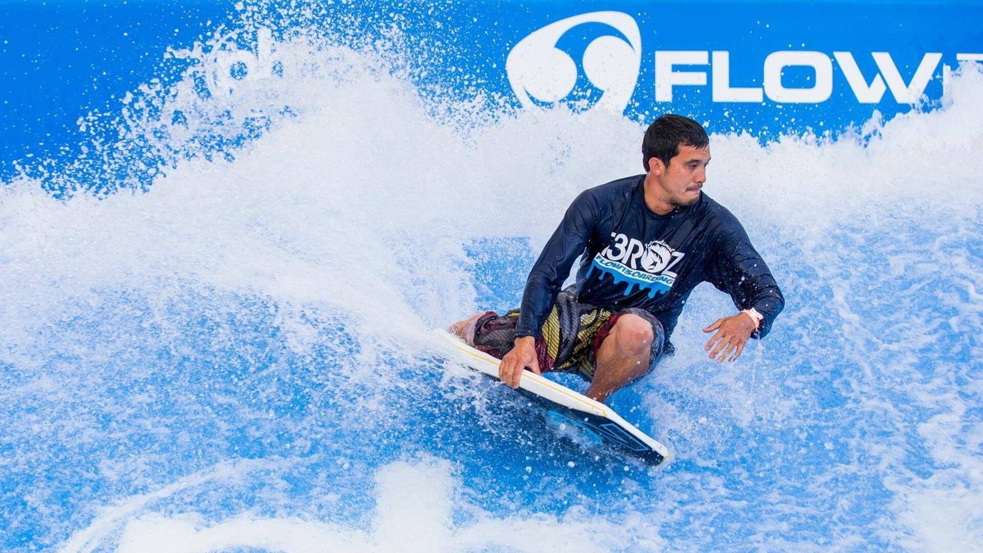 man riding waves at the flowrider at planet hollywood