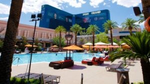 pool cabanas, umbrellas, and pool with a view of MGM Grand in the back