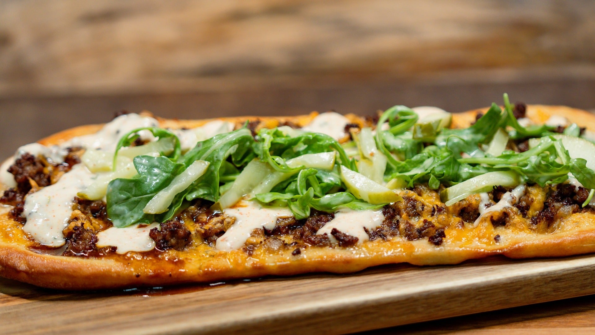 meat and veggies atop bread served on a tray