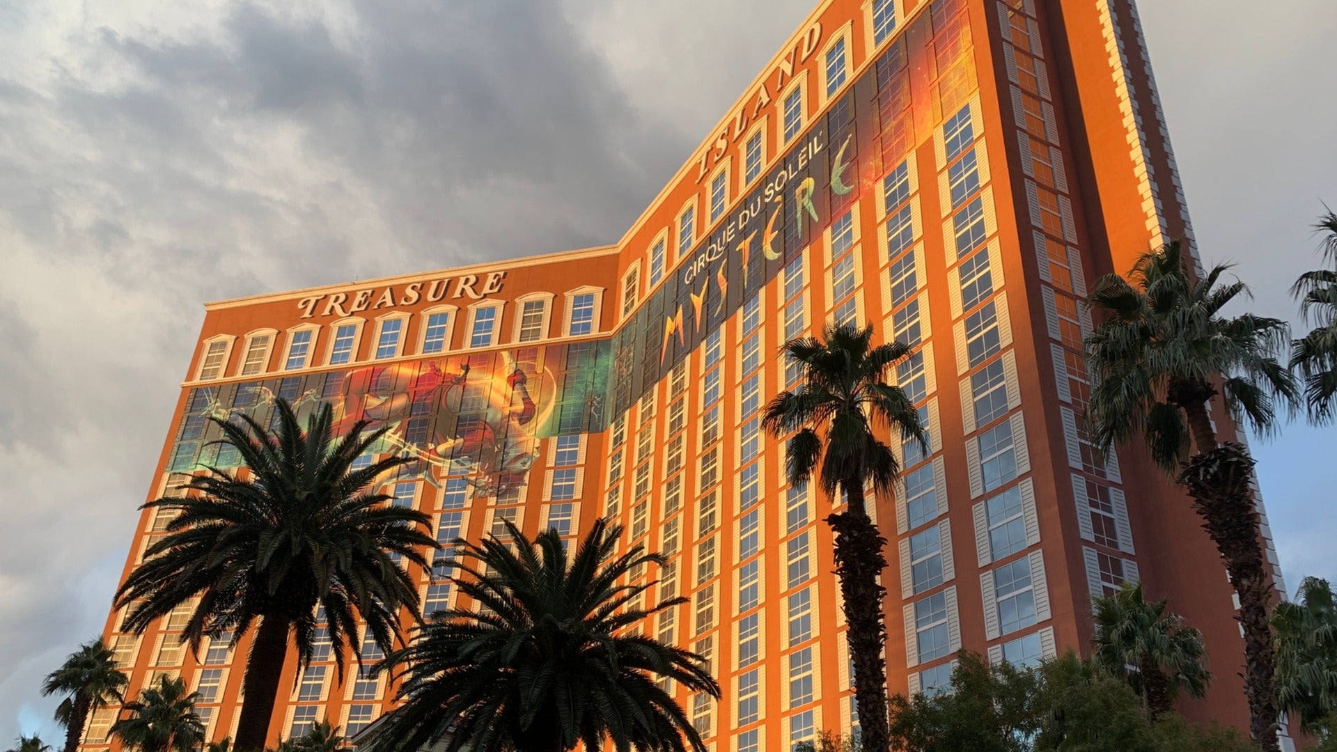 hotel exterior with palm trees