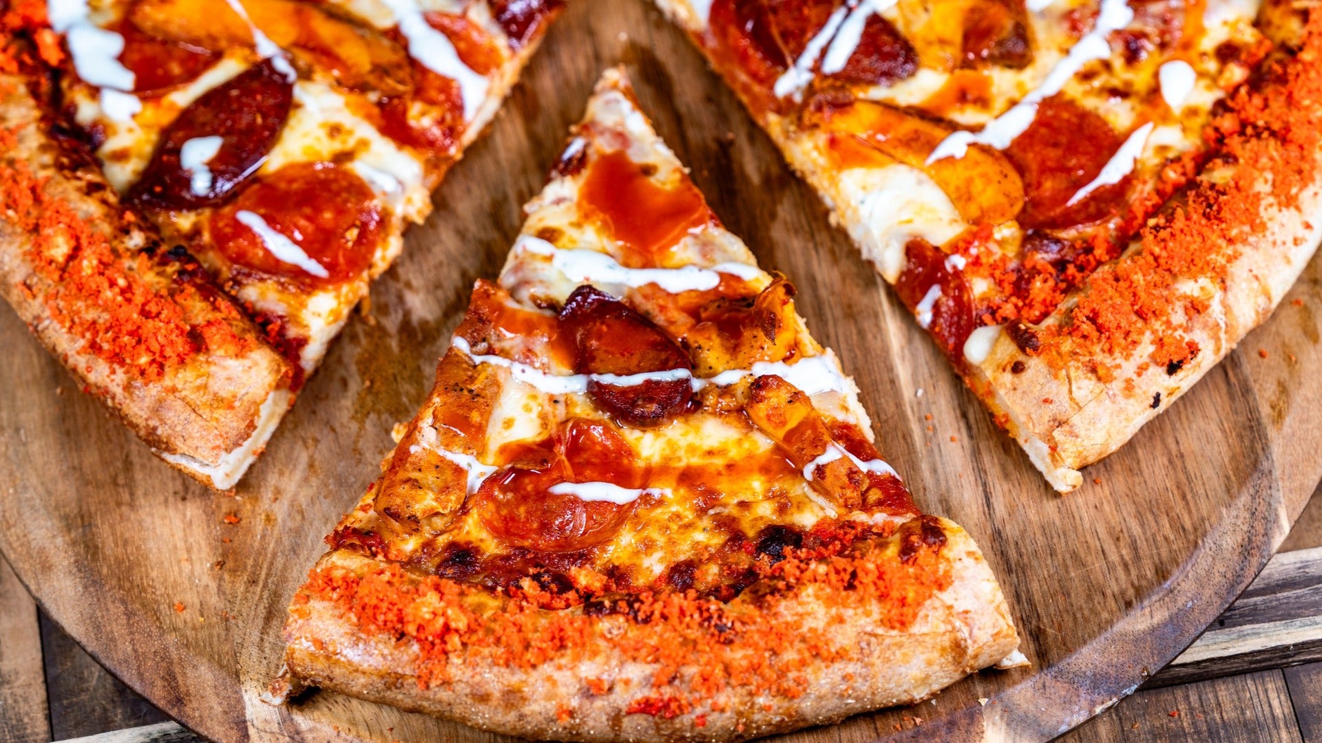 pizza with pepperoni served on a wooden tray