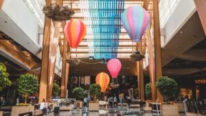 Hotel lobby with fake hot air balloons and greenery