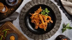 thai food served on a plate with seasonings on the side