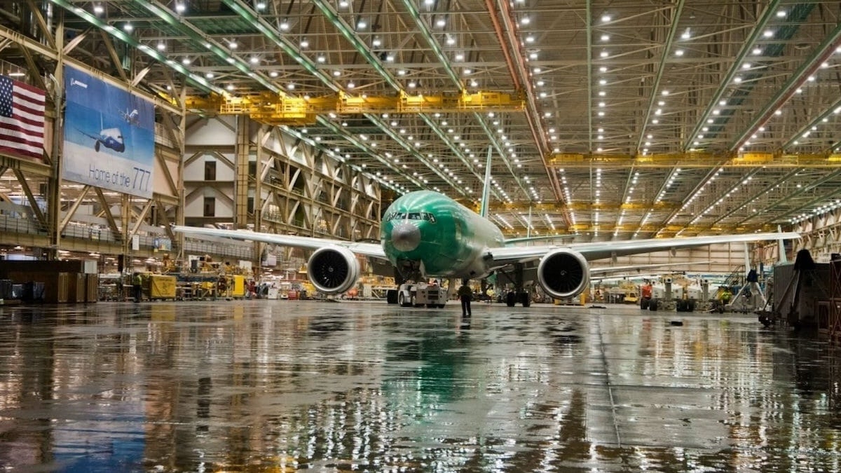 front view of a white with a touch of green airplane