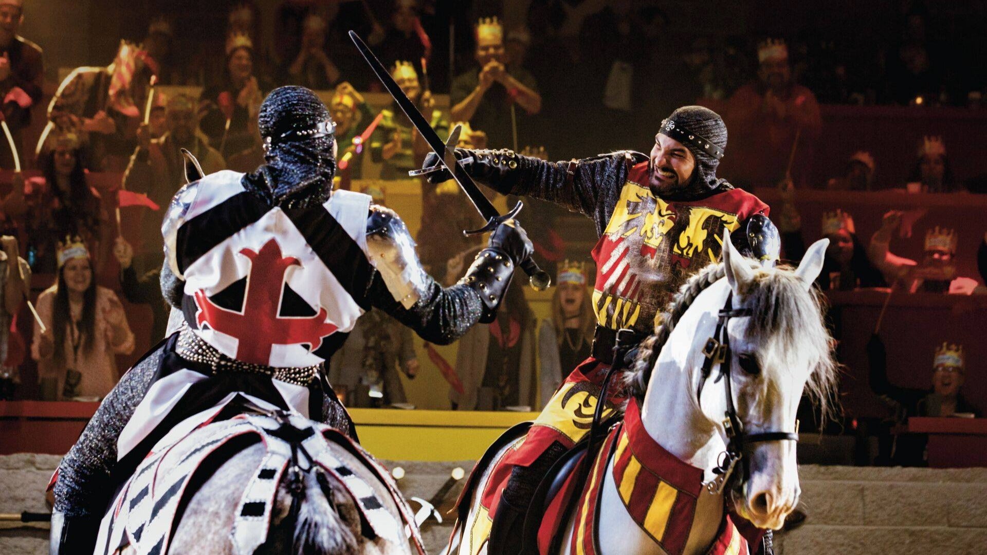 two knights at a medieval times dinner fighting it out