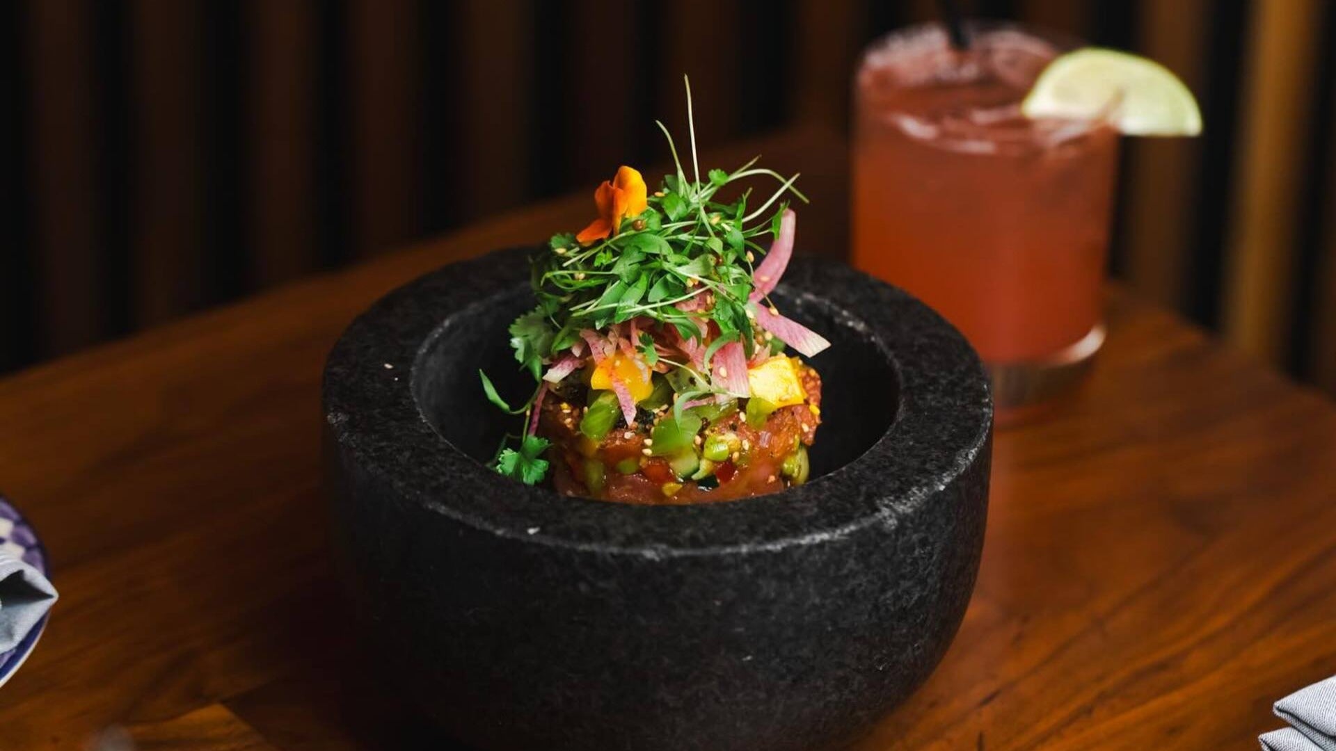 Ahi Poke Bowl with a margarita in the back