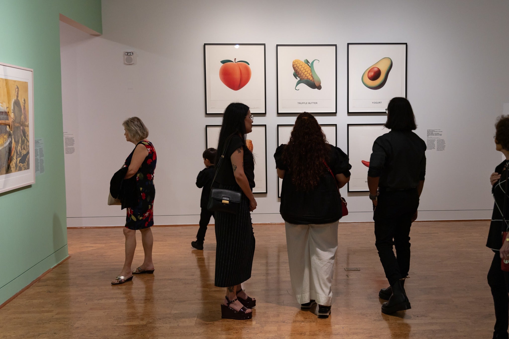 group of people admiring art at a musuem