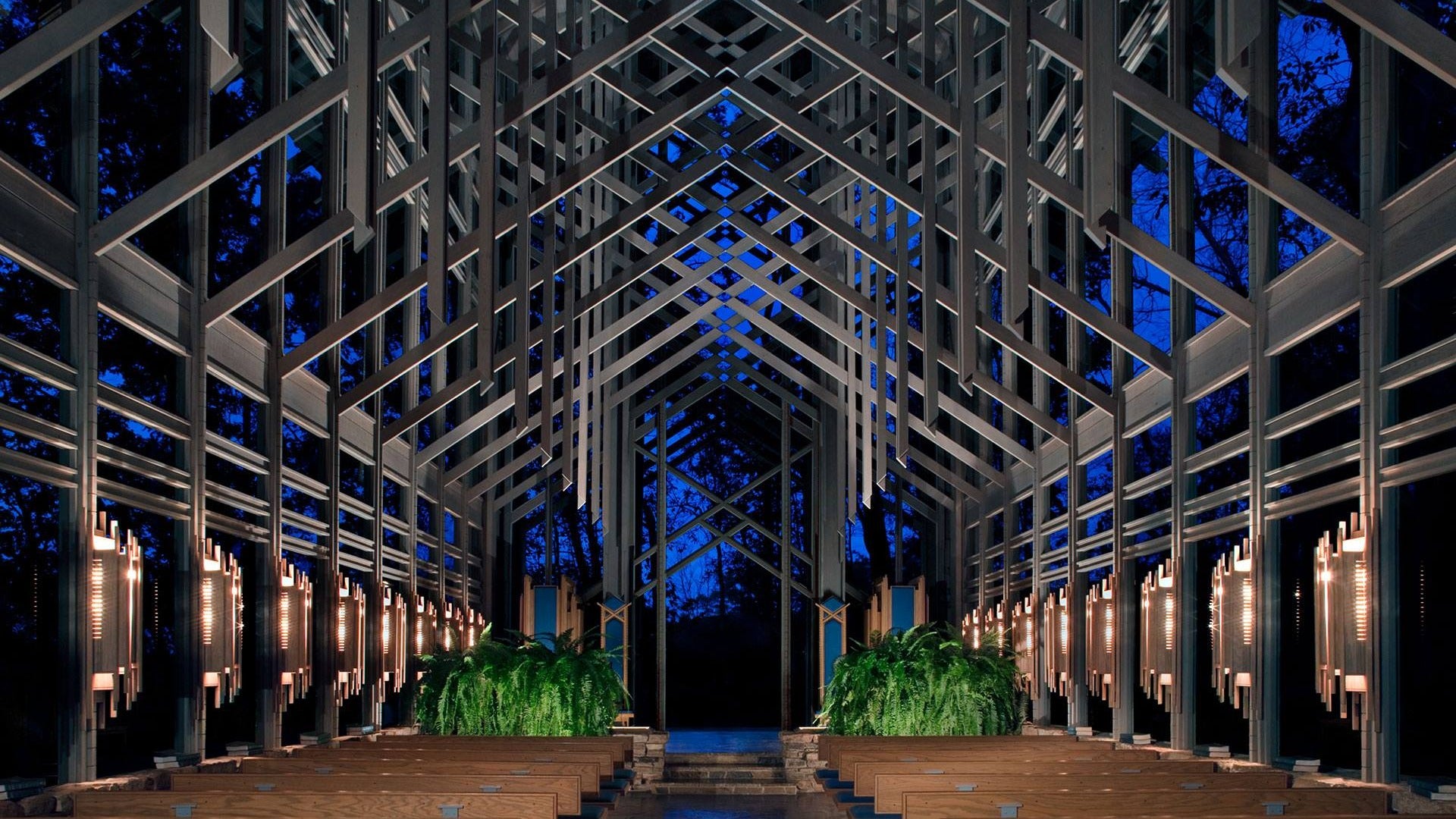 chapel interior with plants and pews