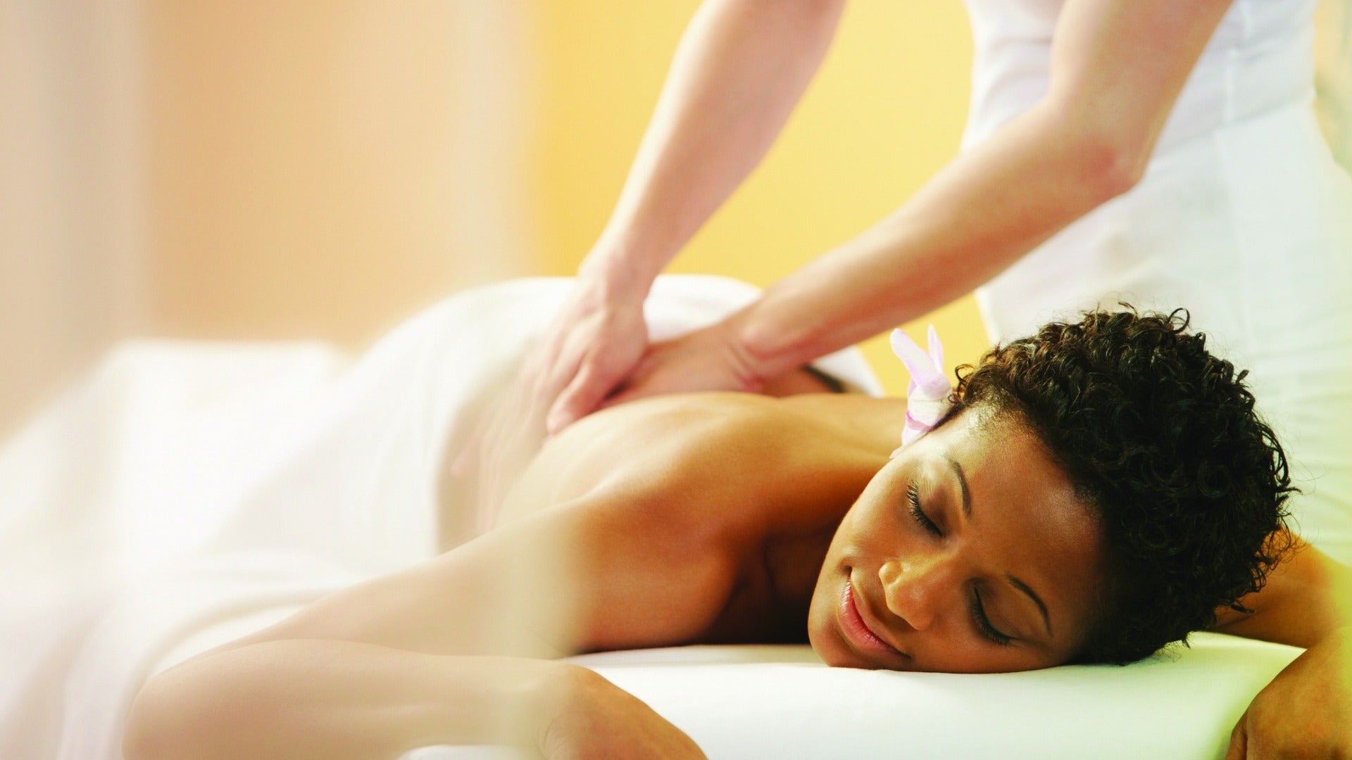 woman getting a massage at a spa