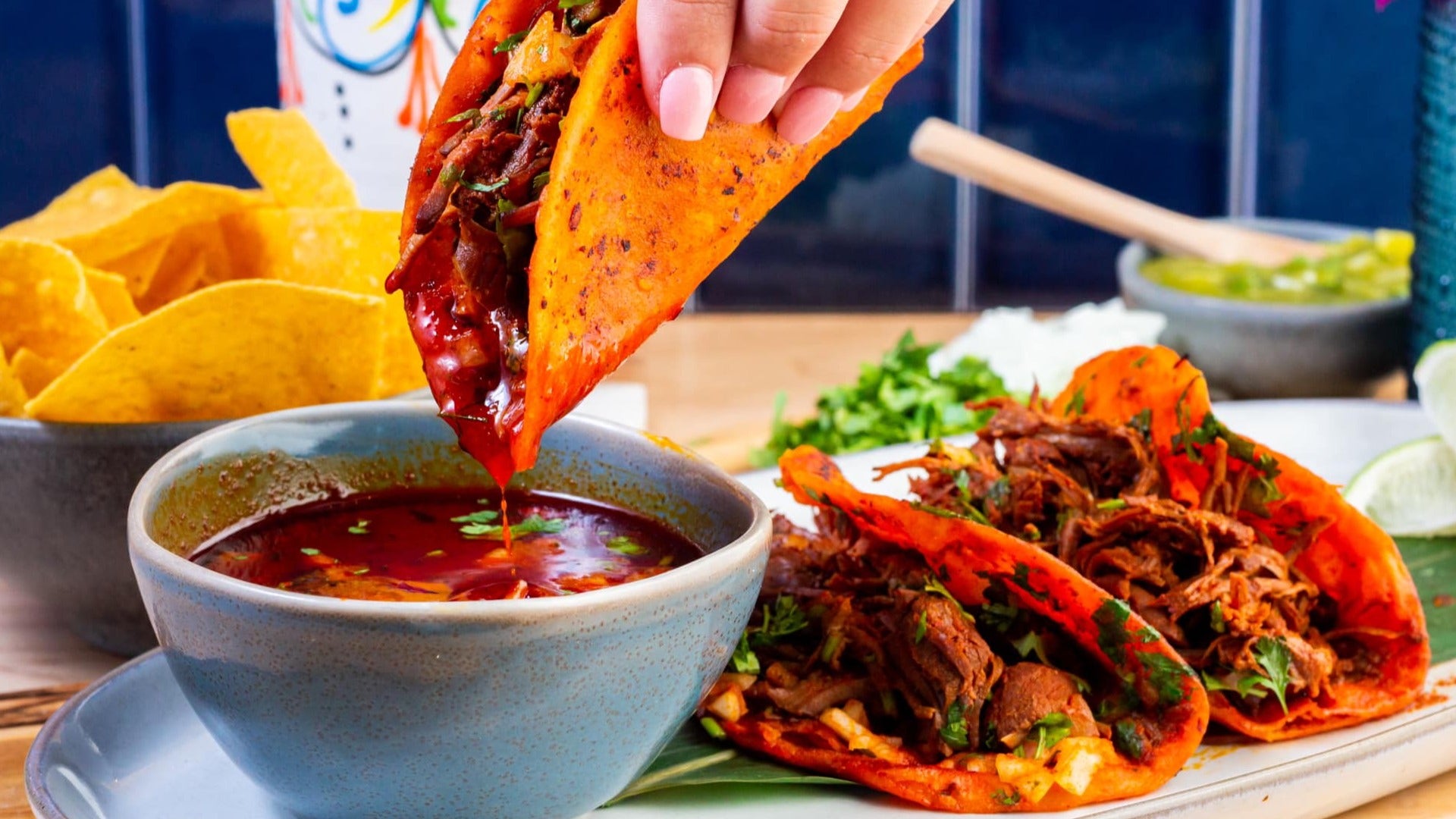 birria tacos with dip and chips on the side