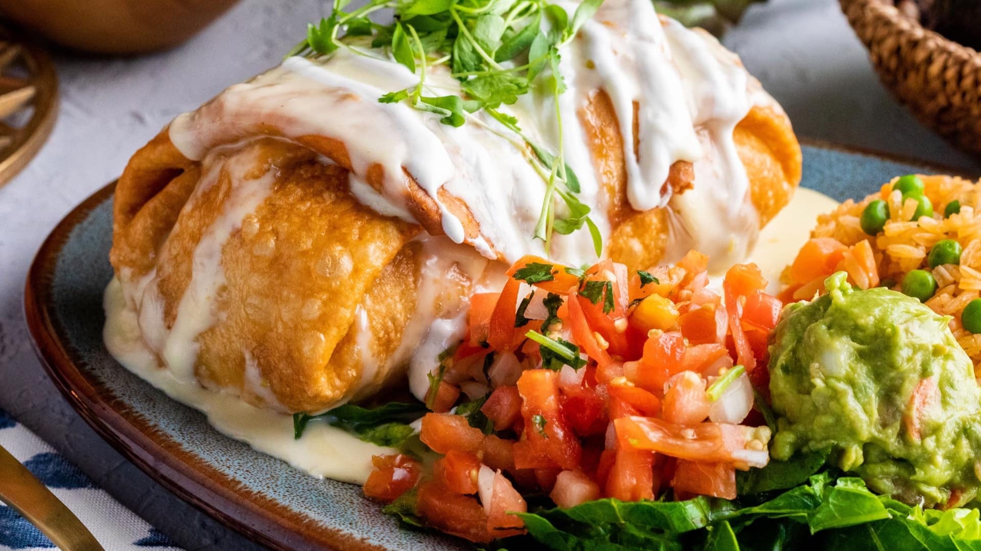 mexican food served with sides on a plate