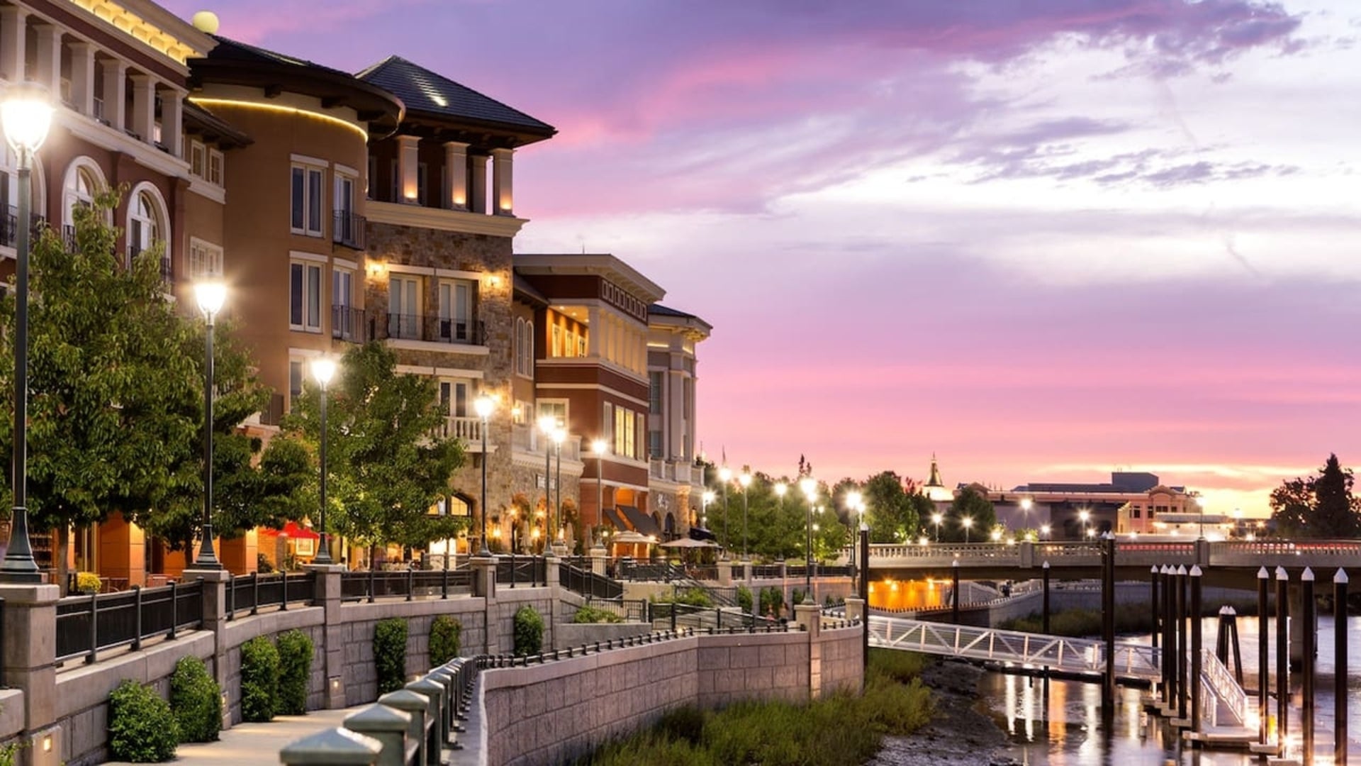 hotel exterior with river and bridge walkway