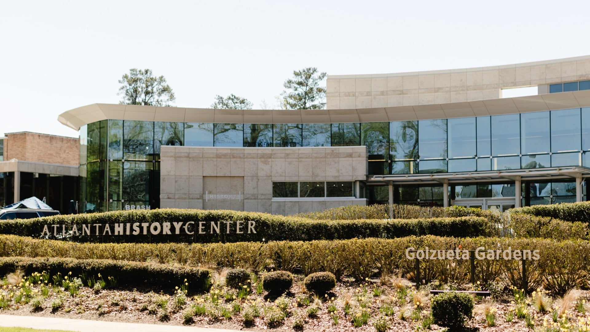 museum exterior with bushes in front