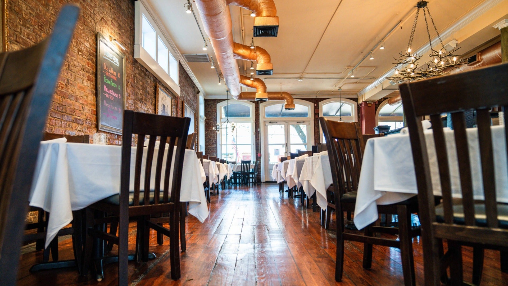 dining tables and chairs with chandelier