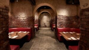 restaurant interiors, speakeasy with booths and table setting