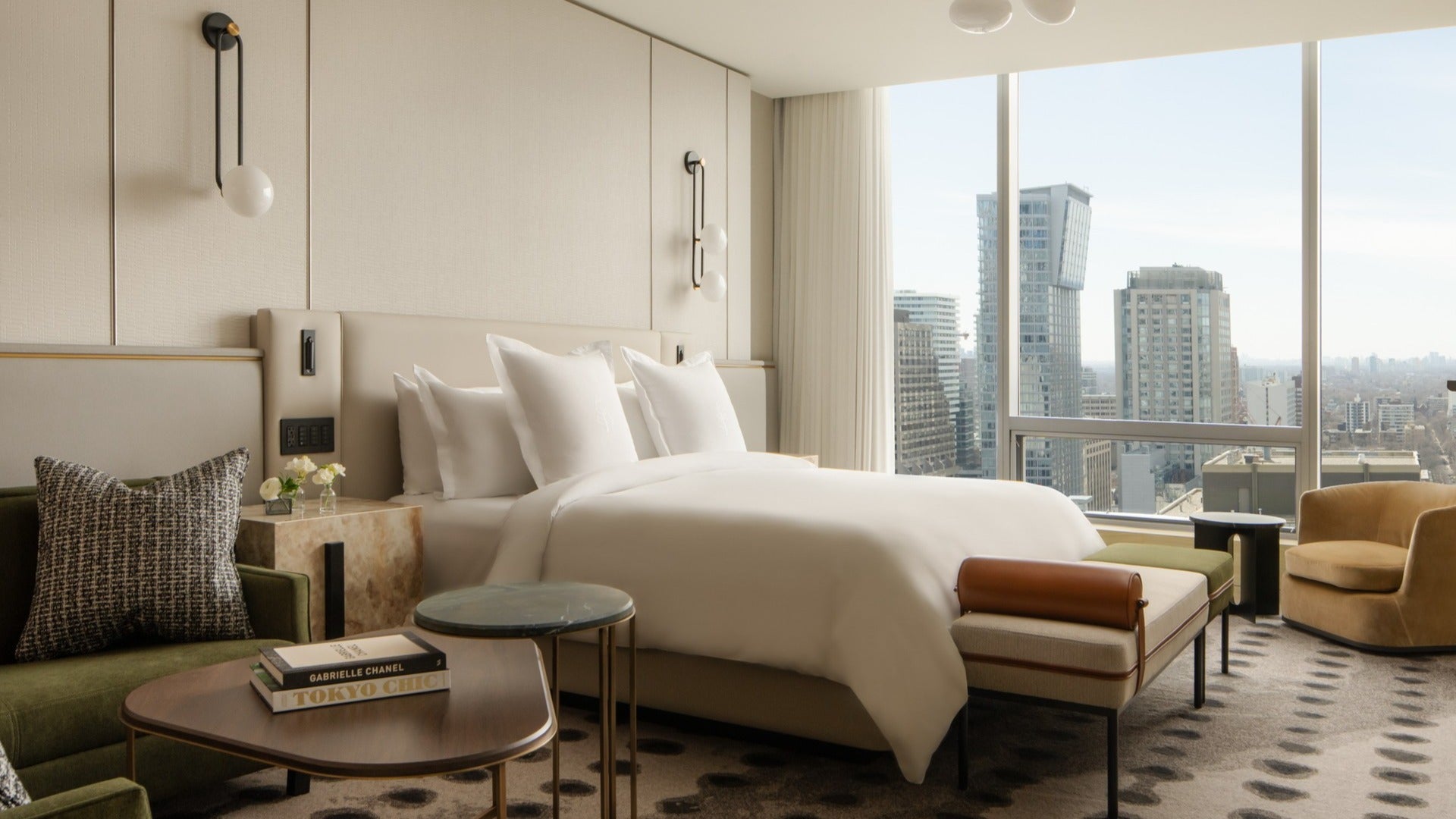 hotel room with chair, bed, big windows