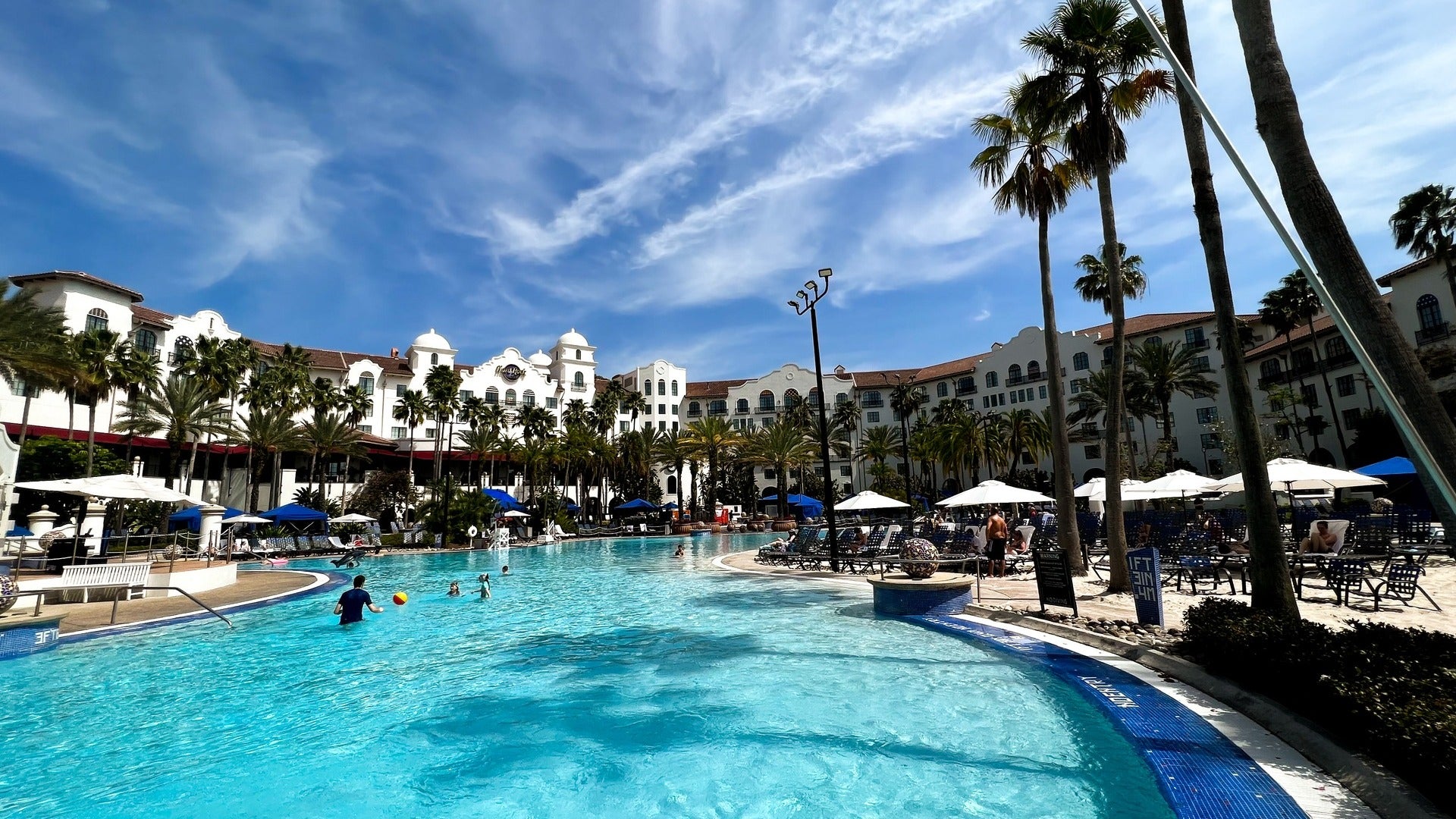 hotel with pool and pool umbrellas