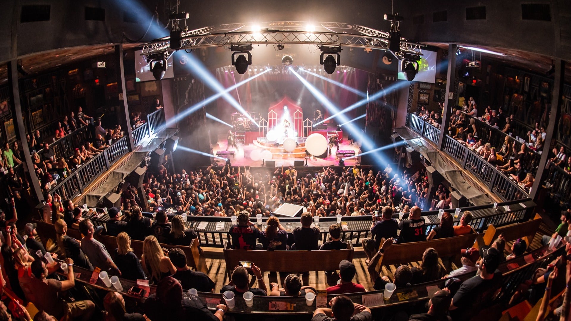 people in a live music venue enjoying a concert