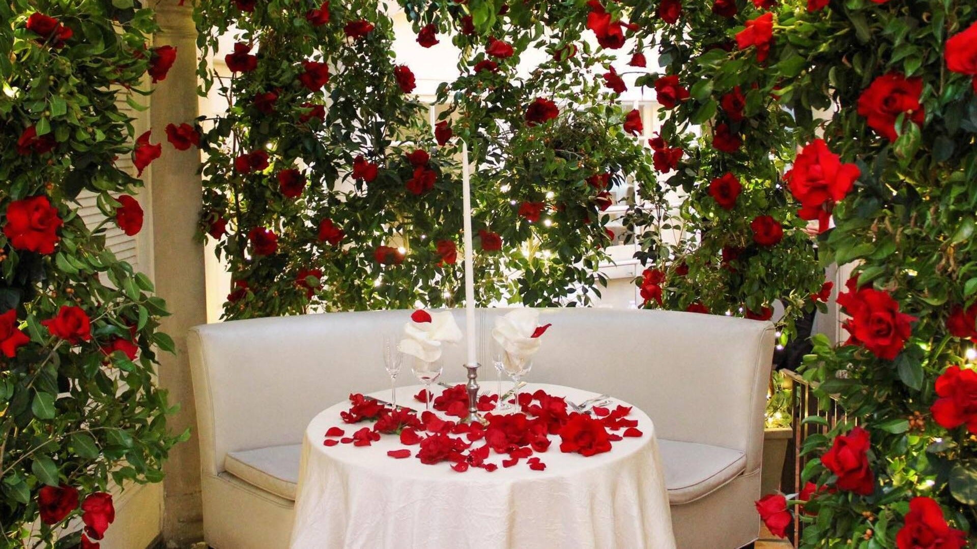 romantic table setup with roses and candle