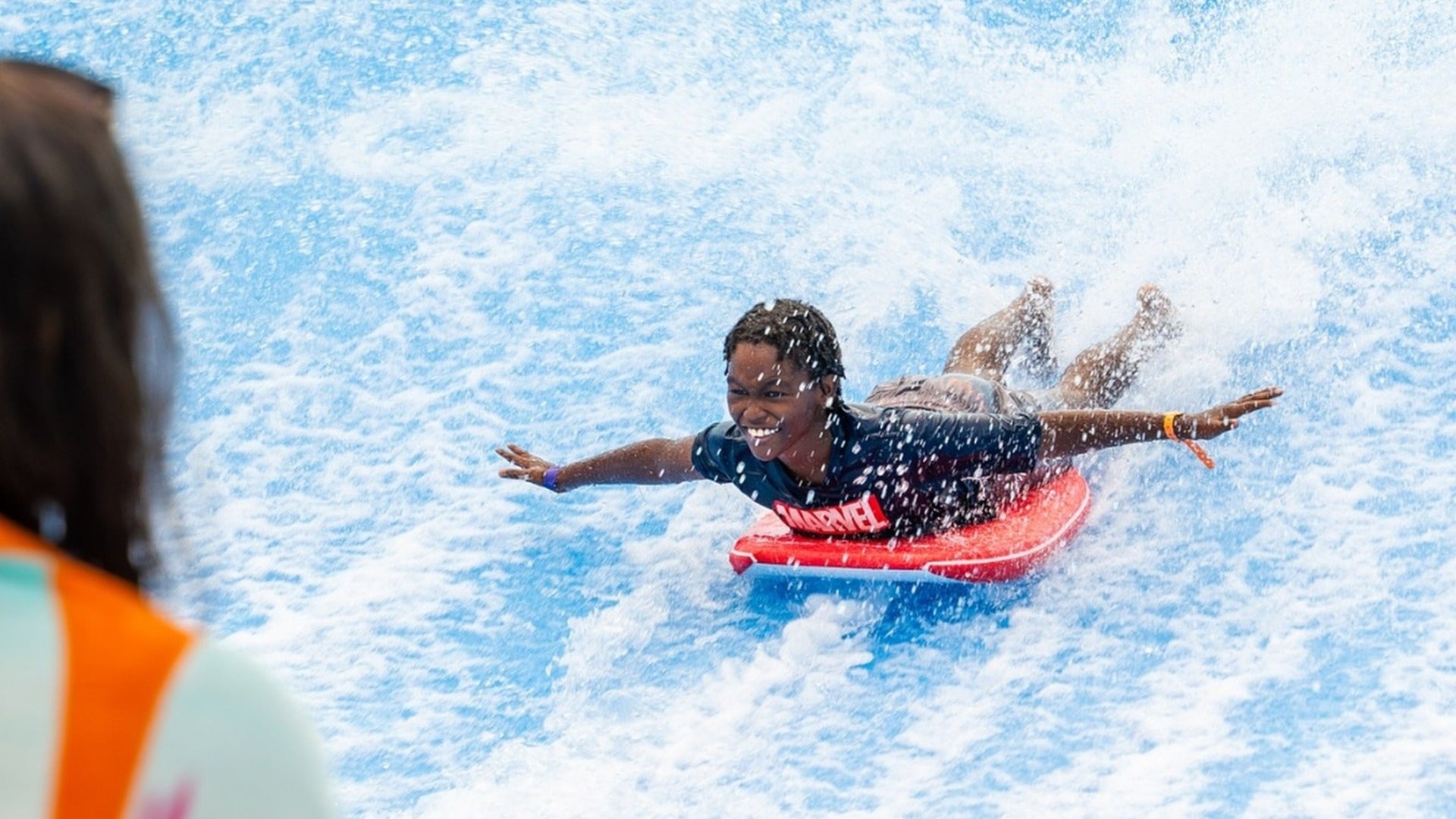 kid enjoying a flow rider water ride