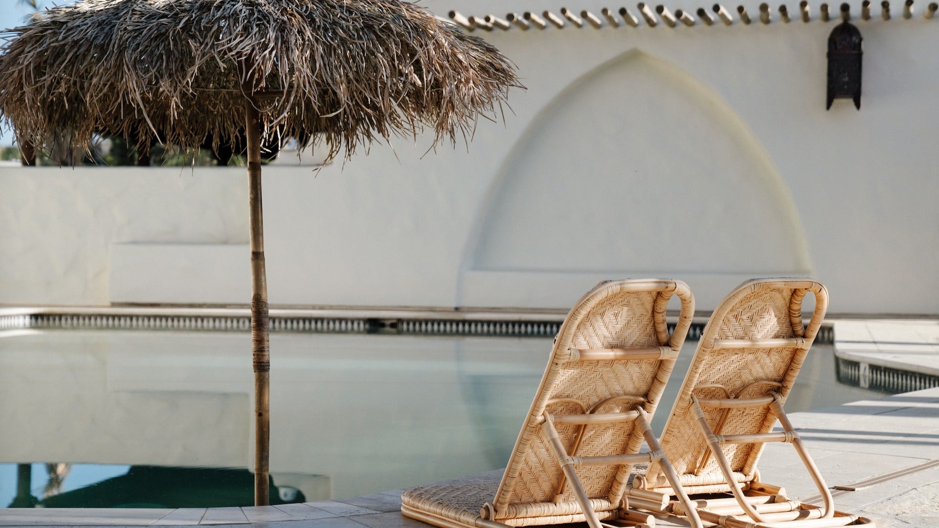 hot springs resort with chairs and poolside shade