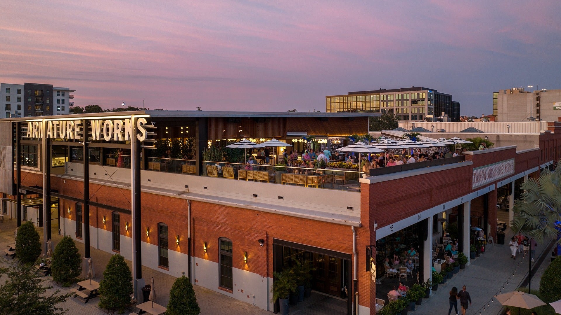 rooftop bar with people and the street below