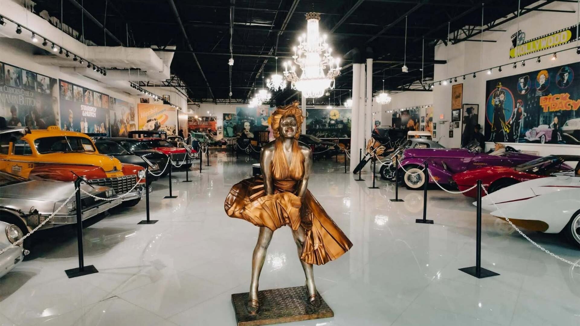 museum of cars with a statue in front