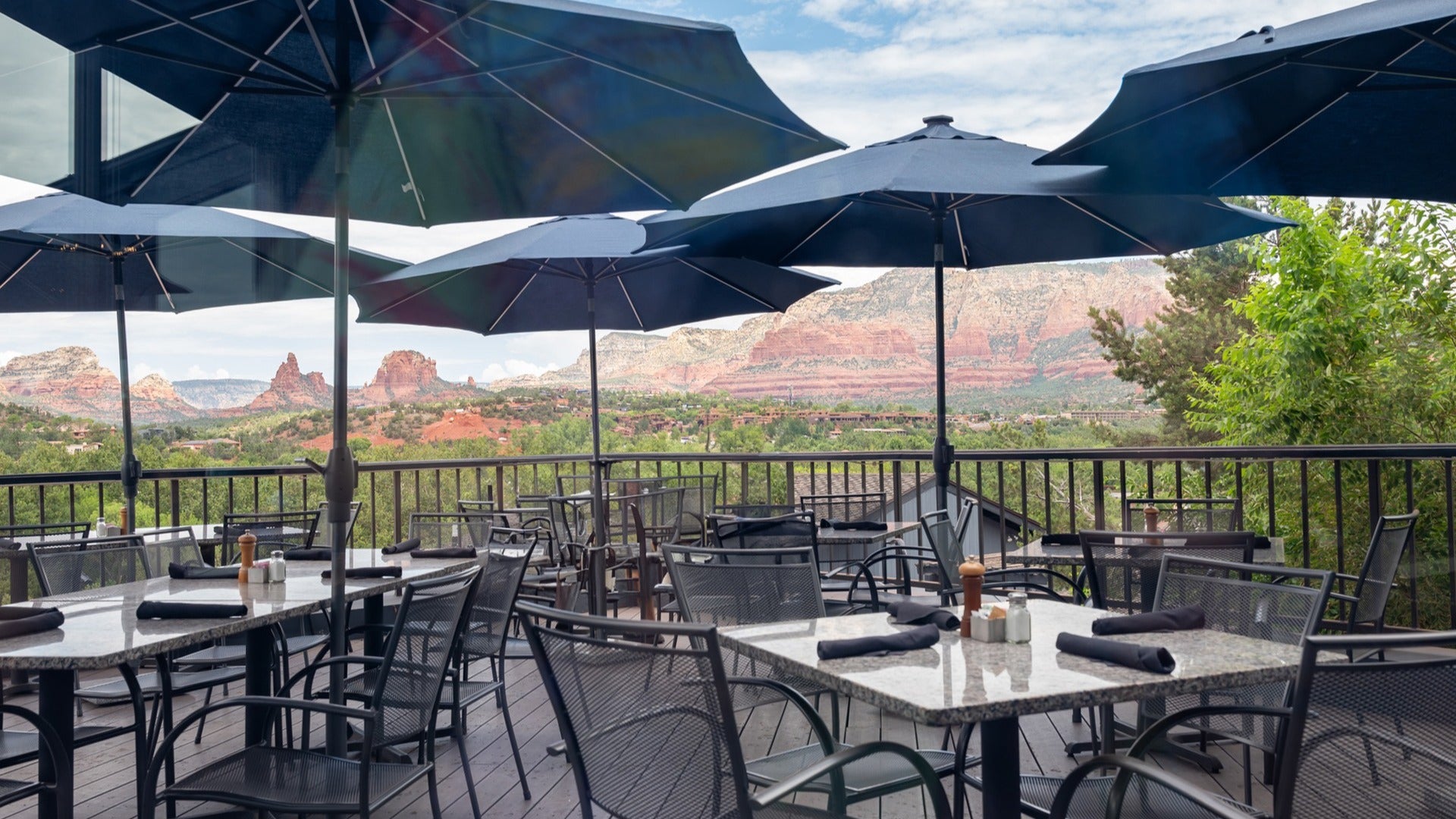 tables and chairs with view of mountains