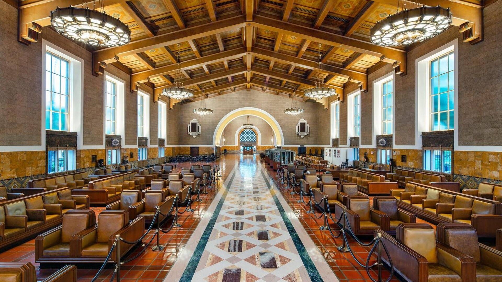 train station with chairs and chandeliers