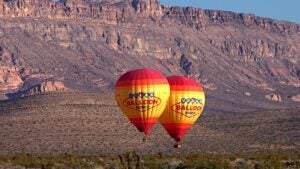 hot air balloons with las vegas red rocks at the back