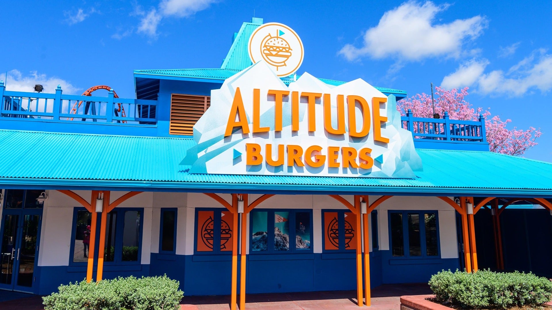 restaurant exterior with plants in front