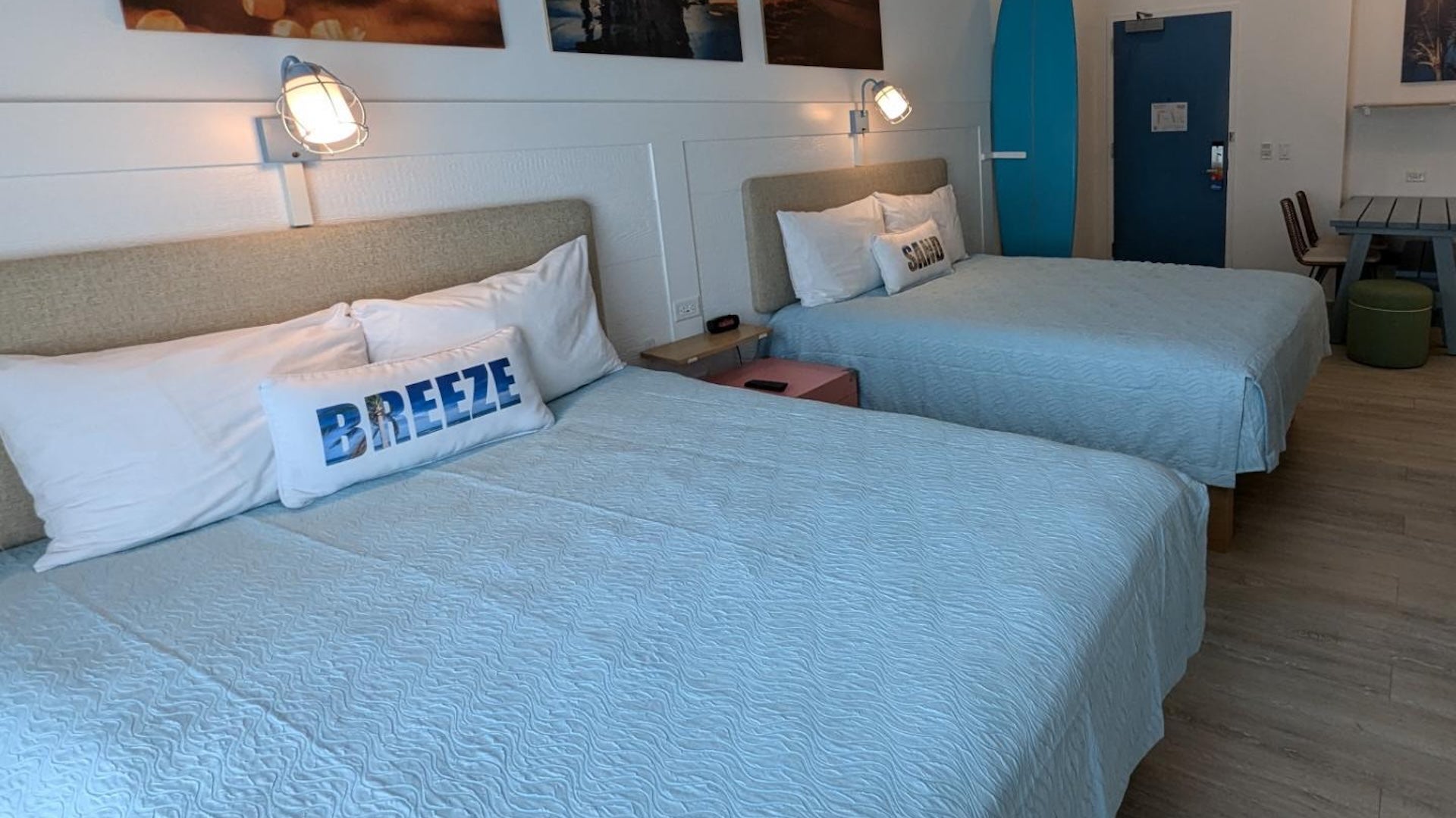 two beds with blue sheets