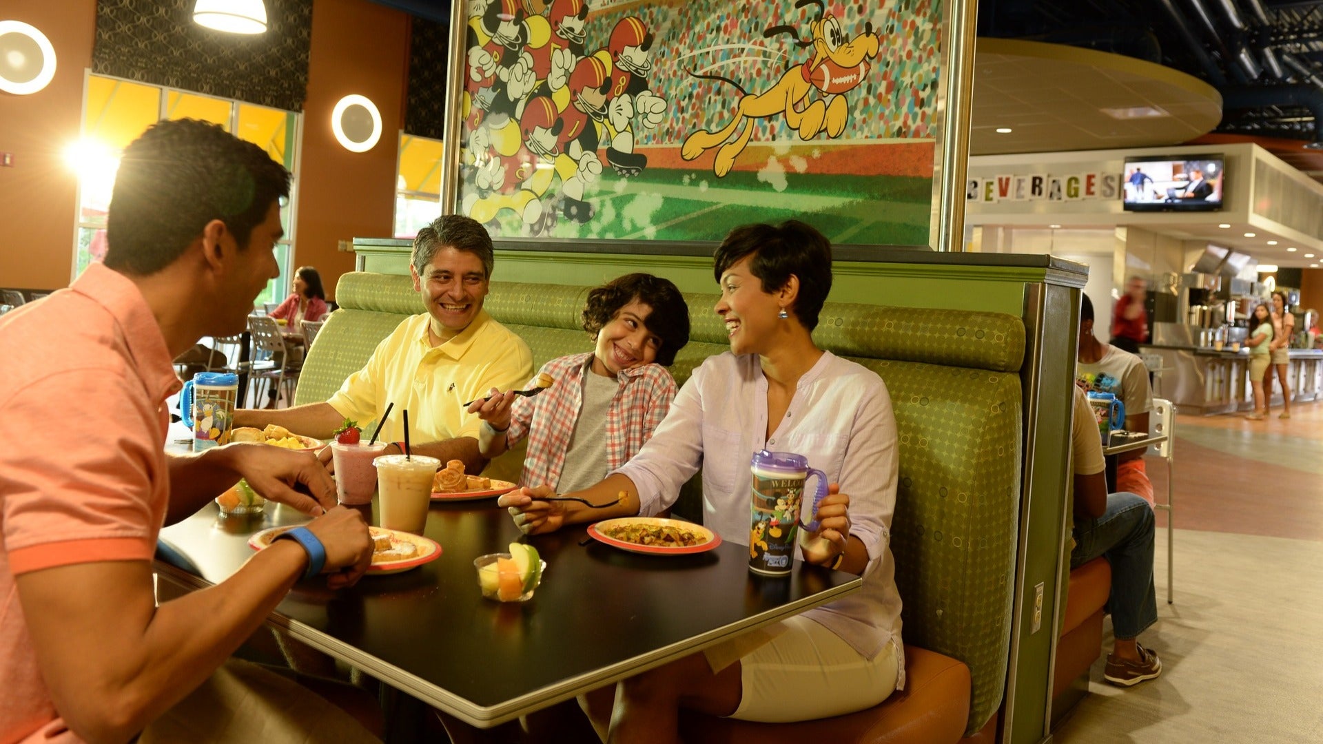 family eating at a food court in booths