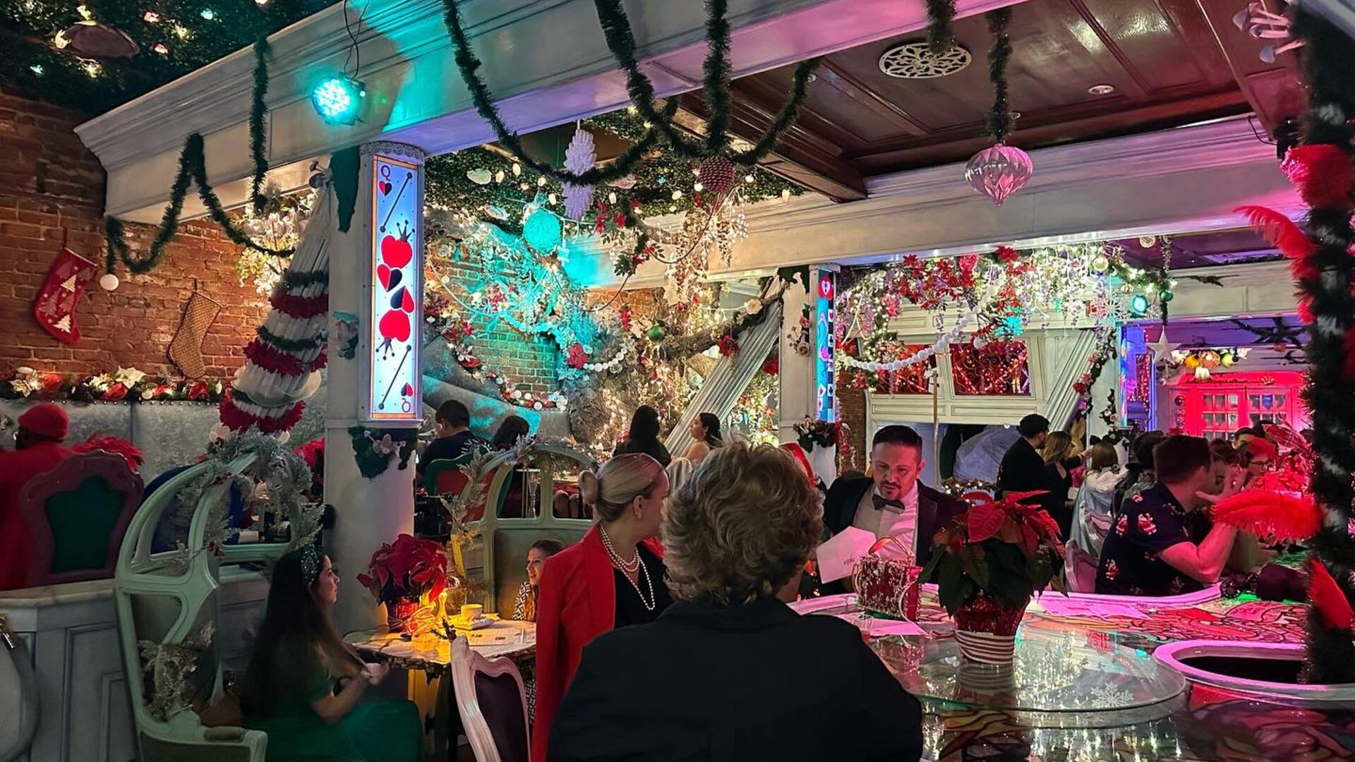 group of people dining in a restaurant with whimsical decor