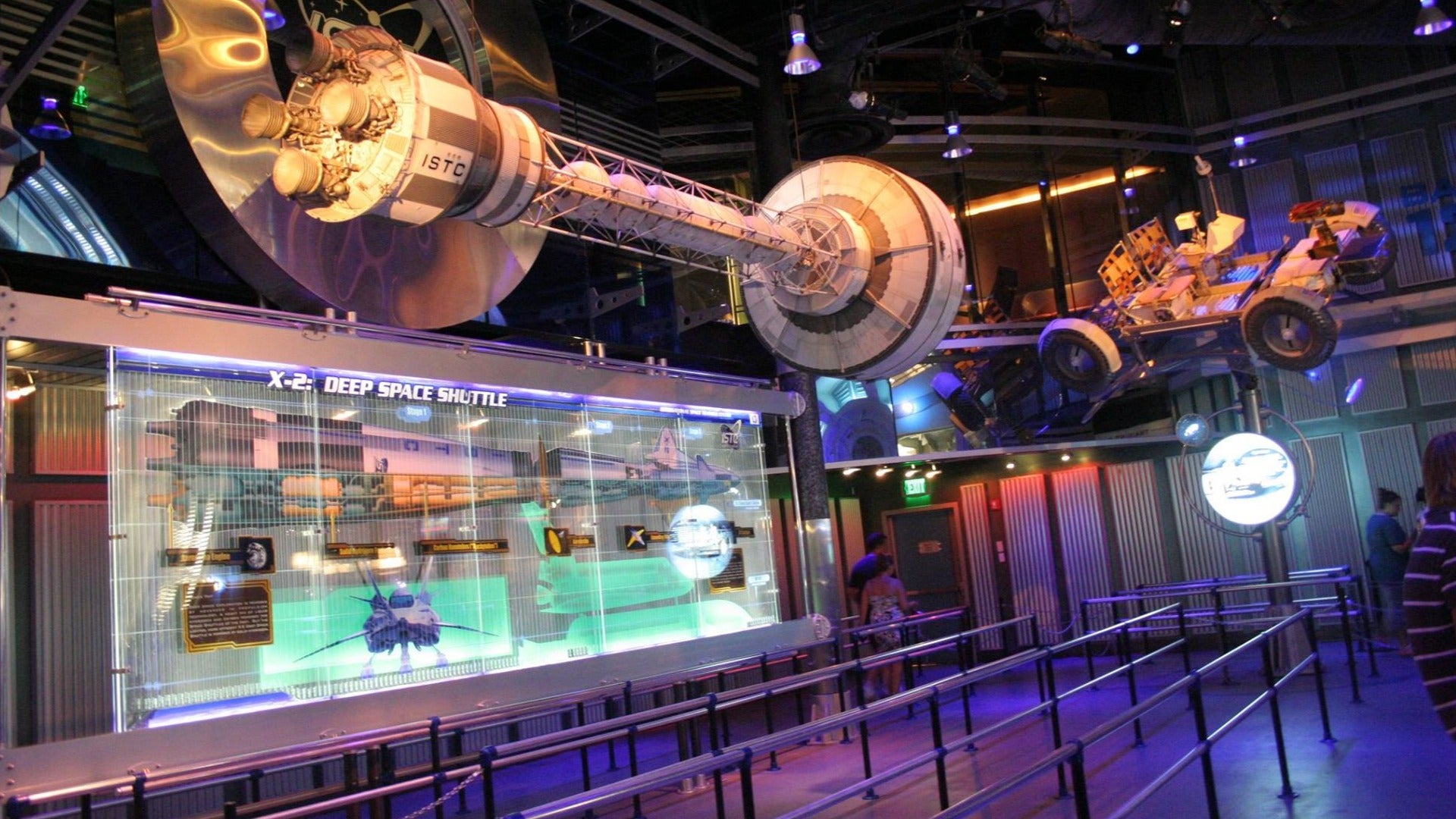 space vehicles suspended on a ceiling with exhibit of deep space shuttles