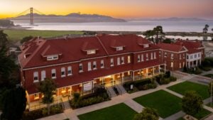 inn with view of golden gate bridge at the back and lawn in front