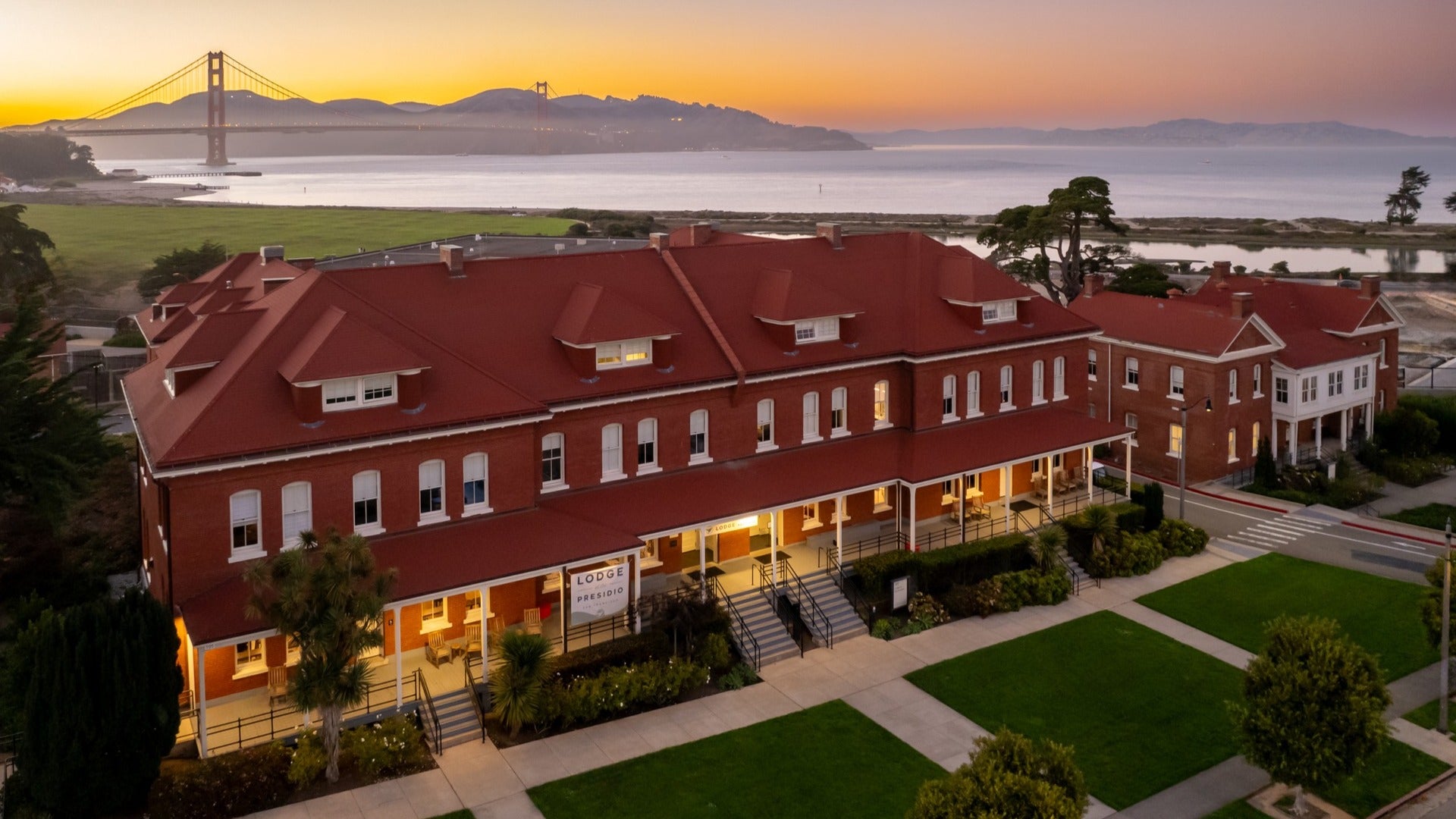 inn with view of golden gate bridge at the back and lawn in front