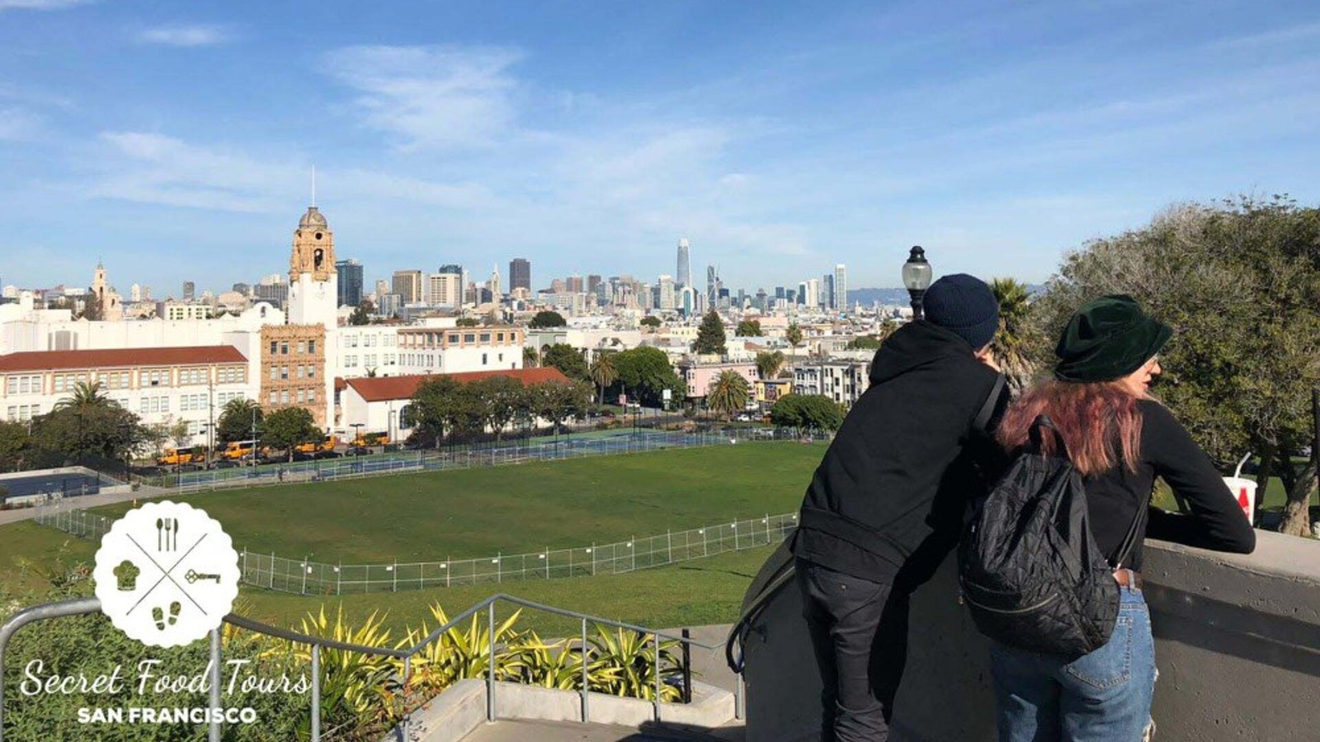 couple enjoying the view with a drink in hand