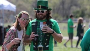 people holding alcohol, celebrating st Patrick's day in costume