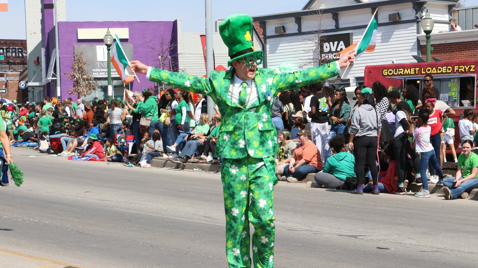 person in a costume during st Patrick's day parade, crowd at the back