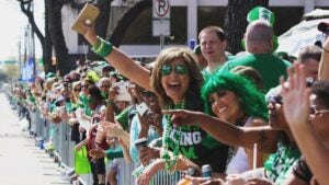 people in a crowd awaiting for st patricks day parade