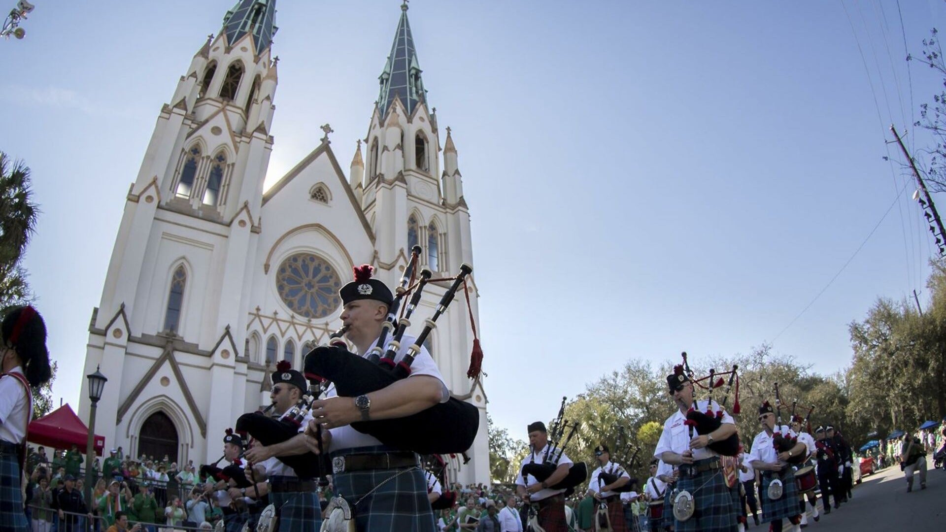 band with blowpipes and church at the background