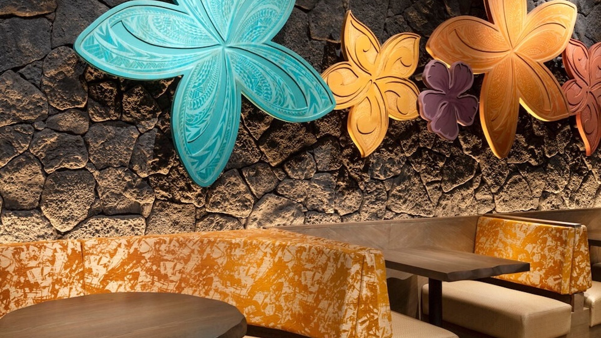 tables with flowers on the wall