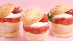 three shortcake jars with strawberries each