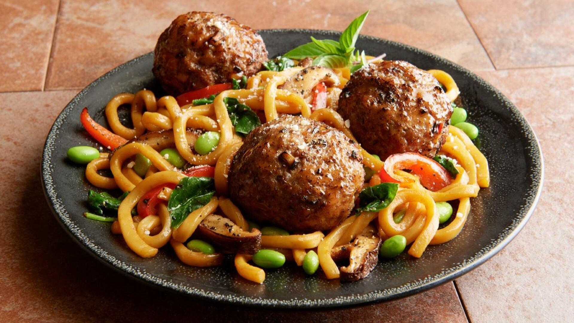 pasta with meatballs served on a plate