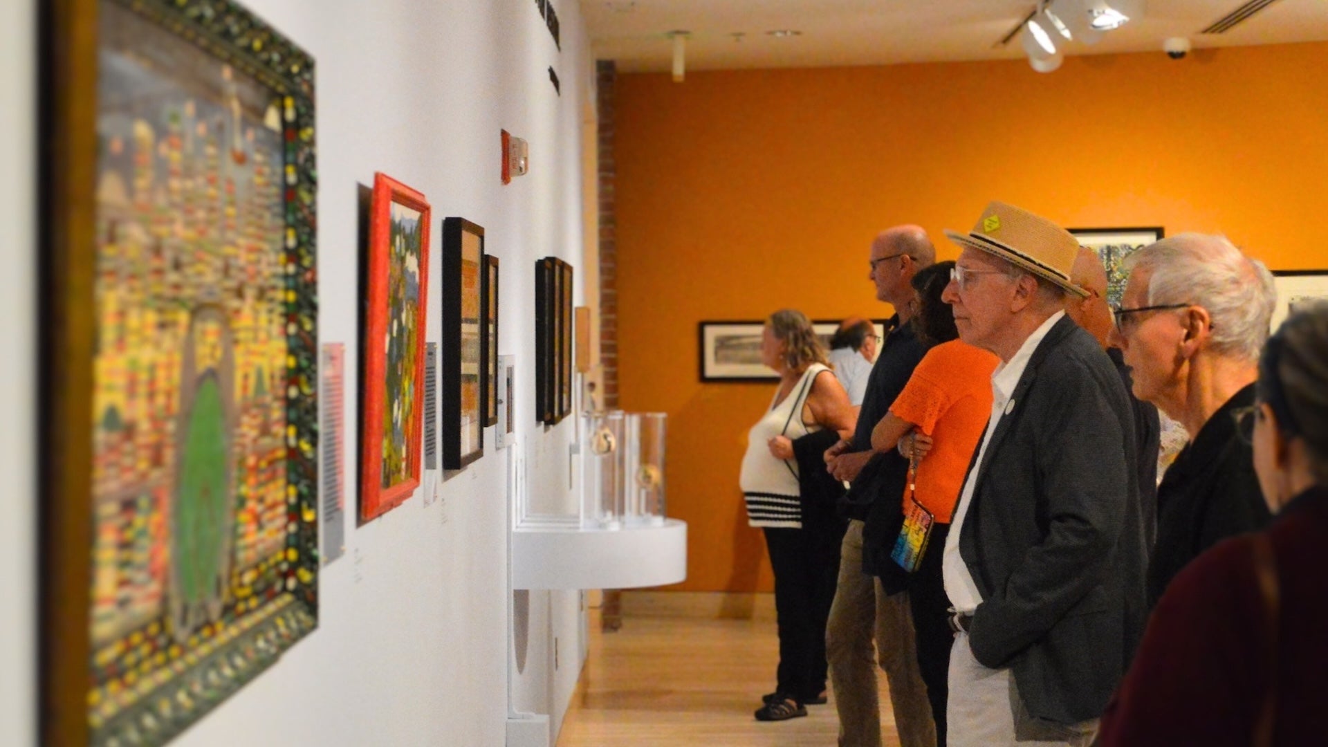 museum visitors looking at artworks