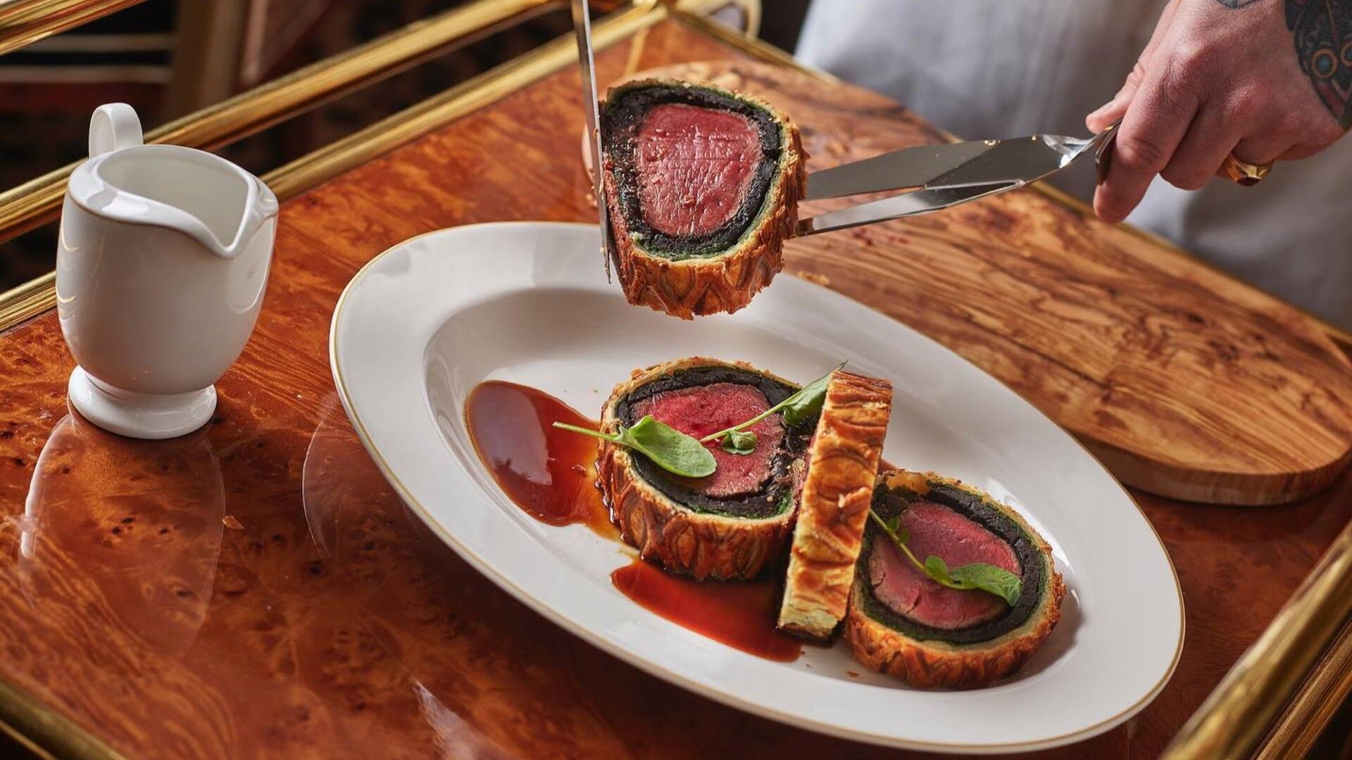 Wagyu Beef Wellington being served on a plate