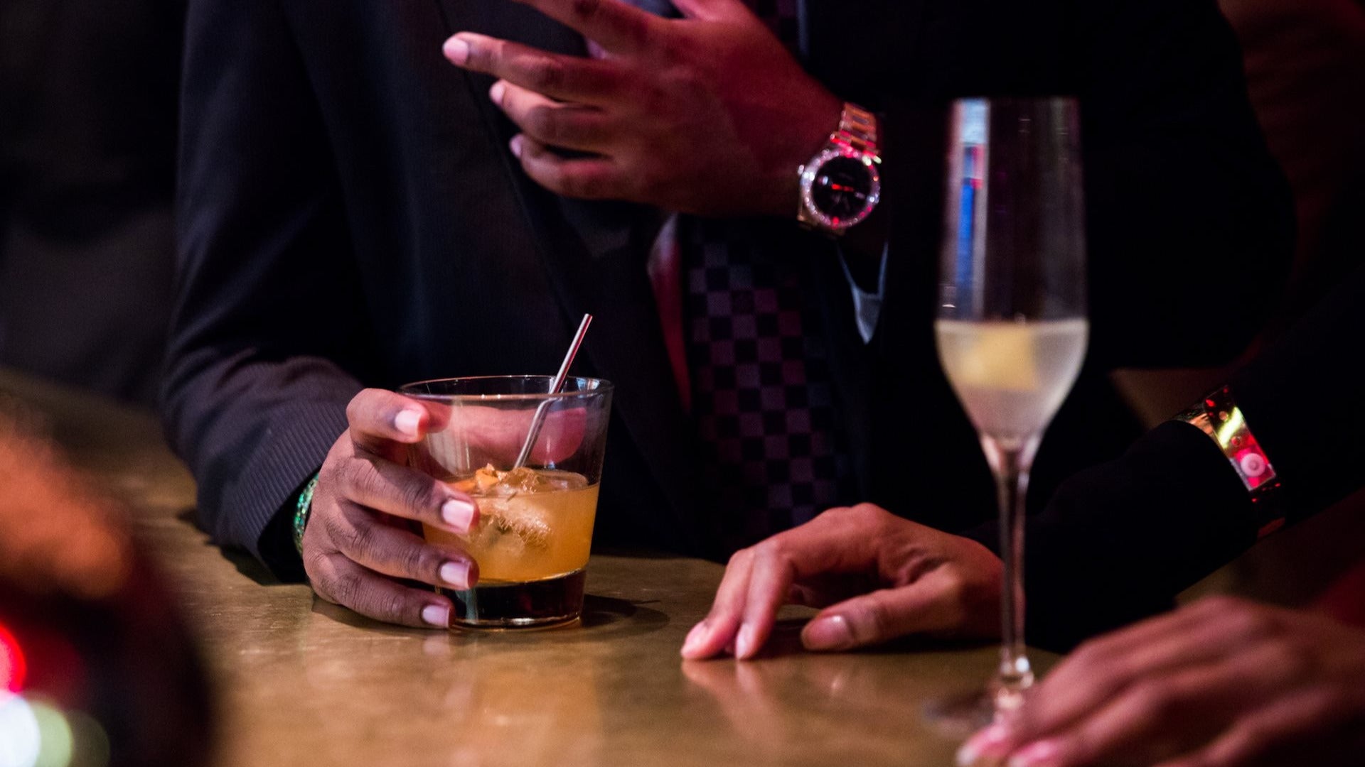 man and woman in a bar with drinks