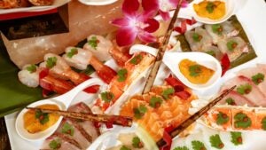 sashimi, salmon, served with edible flowers and sauces