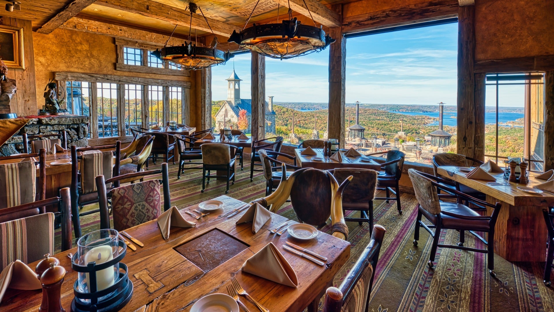 dining tables and chairs with a view of ozark mountains